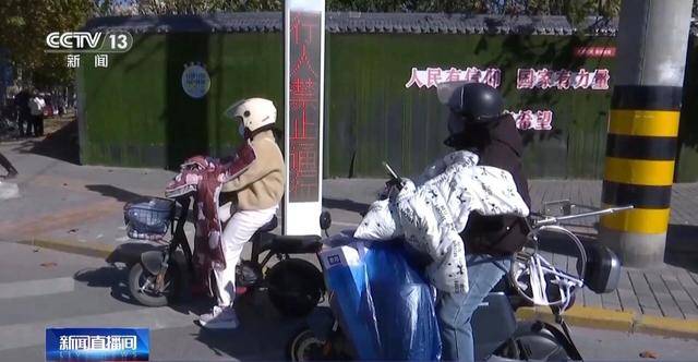 皇冠信用网代理注册_事故频发皇冠信用网代理注册！电动自行车“挡风被”到底该不该用？